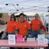 Olivia, Director of Community Development of Wauchula, Rick, City Manager of Wauchula, and Ted selling water, soda and the Grillin Green dollars to buy them with.
