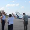 Pilot Carl Saunders goes over Pre-Fight inspection of plane with his group