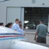 Pilot Carl Saunders goes over Pre-Fight inspection of plane with his group
