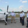 Pilot Mike Wilkerson goes over Pre-Fight inspection of plane with his group