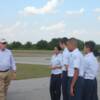 Pilot Mike Wilkerson goes over Pre-Fight inspection of plane with his group
