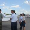 Pilot Carl Saunders goes over Pre-Fight inspection of plane and how everything works with his group