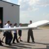 Pilot Carl Saunders goes over Pre-Fight inspection of plane and how everything works with his group