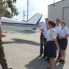 Pilot Carl Saunders goes over Pre-Fight inspection of plane and how everything works with his group