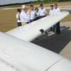 Pilot Mike Wilkerson goes over Pre-Fight inspection of plane and how everything works with his group