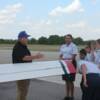 Pilot Dale Johnson goes over Pre-Fight inspection of plane with his group