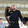 One of the Hardee County Sheriff's Deputy with a snake on his back