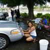Rosa washing a car