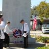 Sandy Scott (sister to Frederick Rickets (KIA) and Post Commander Joe Filice place wreath in front of the American Legion Monument
