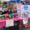 Grils of the Girls Souts selling their famous Girls Scout Cookies on Main Street