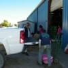 Ryan Loads supplies on customer's truck