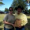 Calli presenting the John Wayne Award to Luie Pella who was the Trail Boss for this trail ride.