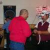 Ken and Gonzales giving out tickets for the upcoming door pizes