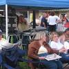 Locals enjoying the afternoon reading the newspaper at Main Street Haritage Park
